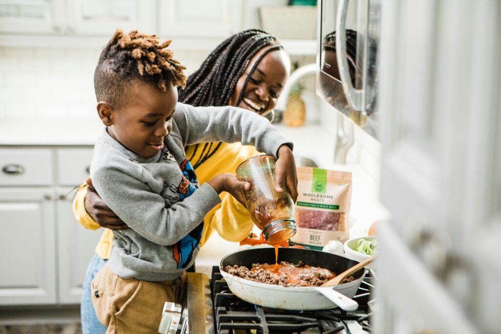 Mother and child cooking together at home